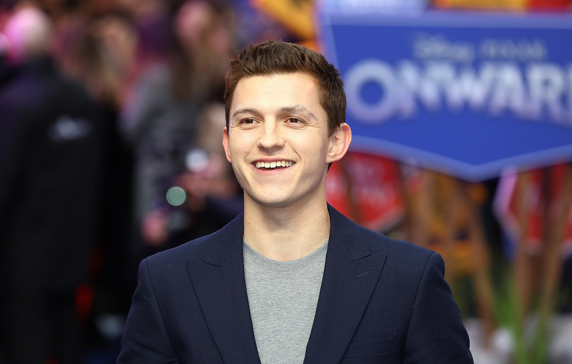 Tom Holland smiles while attending the "Onward" UK Premiere in 2020