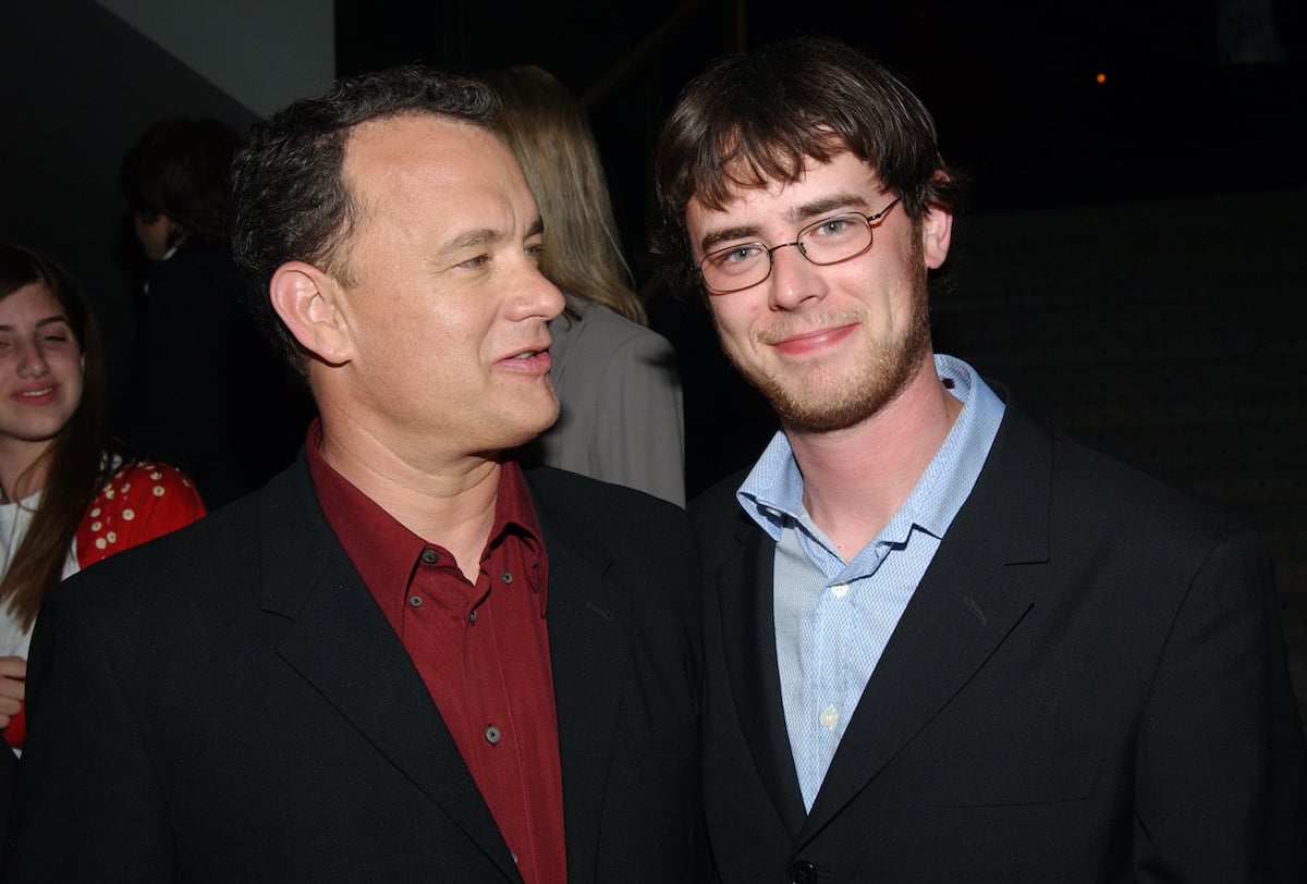 Tom Hanks looks at his son, Colin Hanks who poses for the camera at 'The Terminal' world premiere