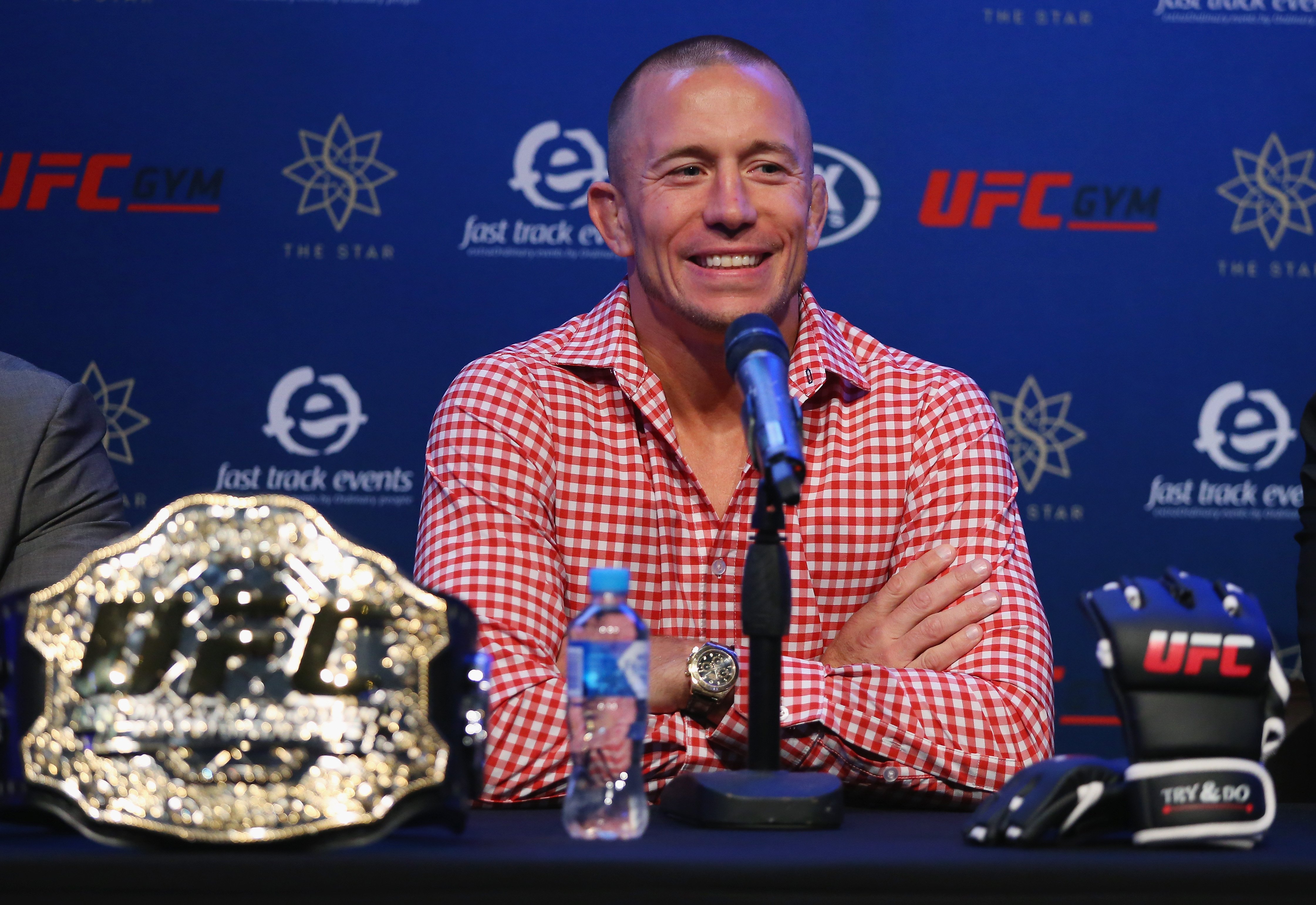 UFC fighter Georges St-Pierre speaks during a press conference in 2018