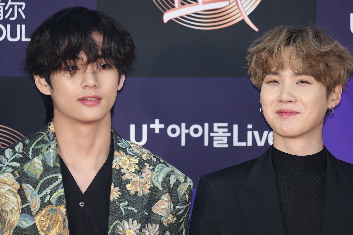 V and Suga of Bangtan Boys (BTS) arrives at the Golden Disc Awards, smiling for a picture together