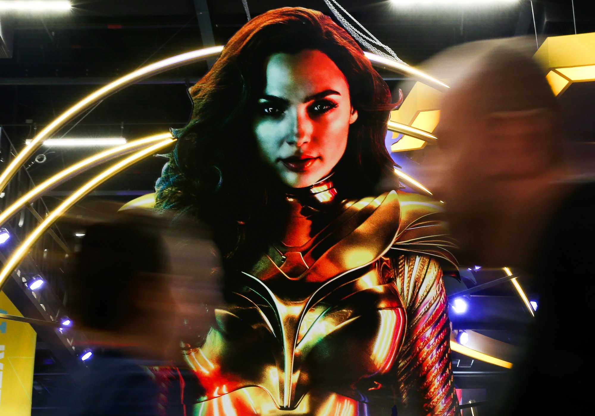 Wonder Woman backdrop with blurred people passing