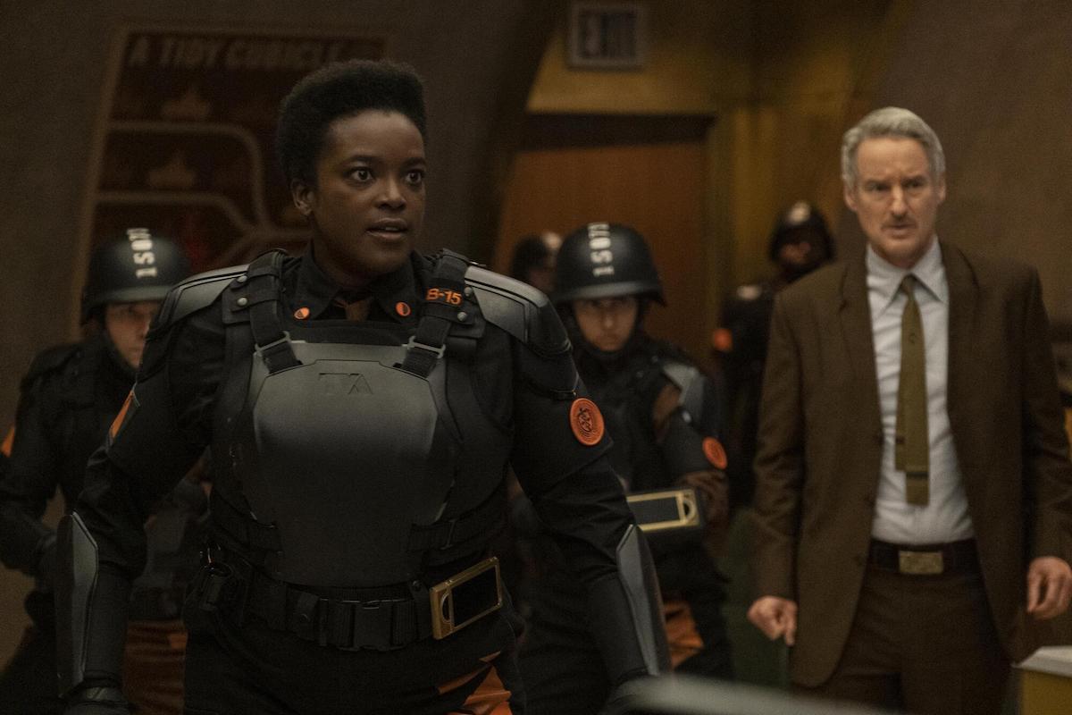 Wunmi Mosaku in black protective gear and Owen Wilson in a brown suit in Marvel's 'Loki' on Disney+