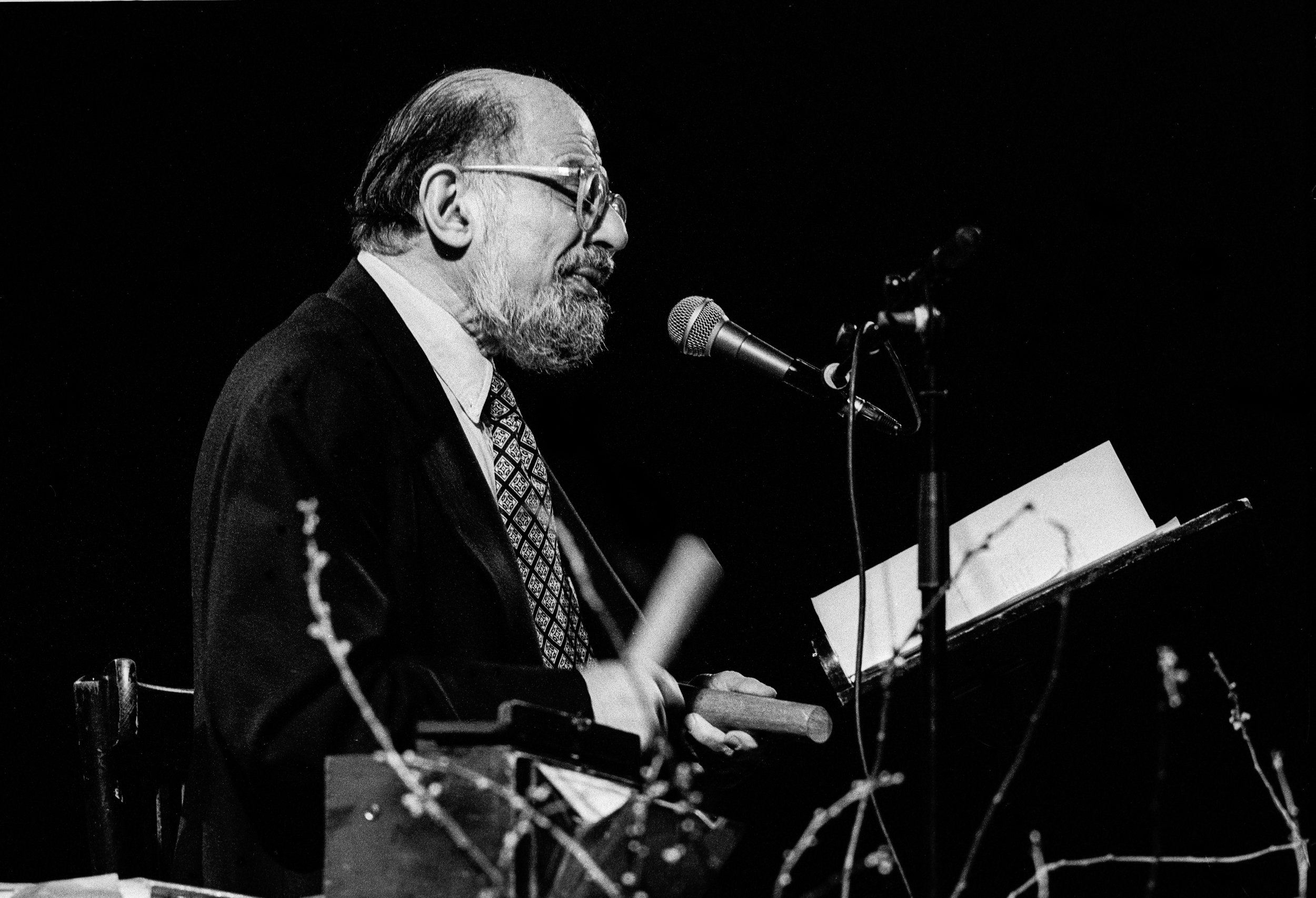 Allen Ginsberg with a michrophone