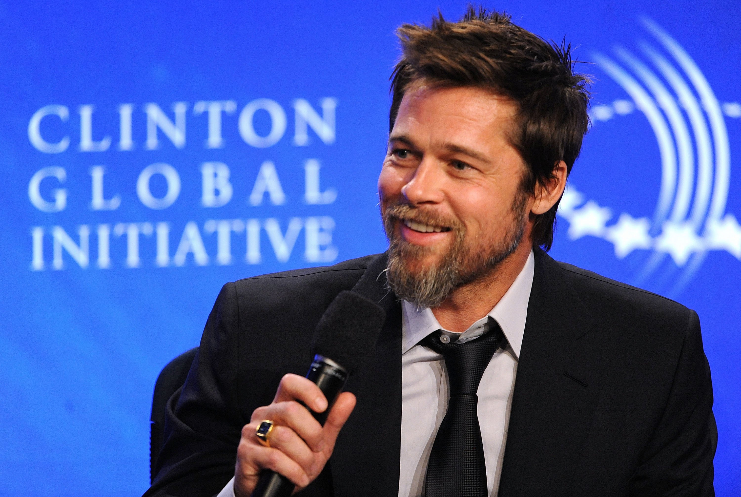 Brad Pitt with a microphone