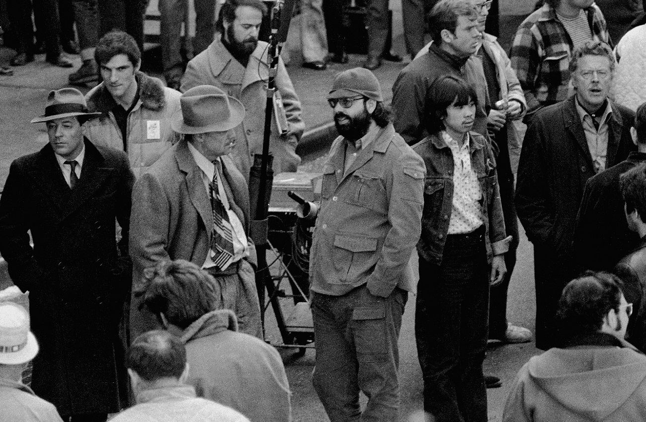 Marlon Brando and Francis Ford Coppola discuss a 'Godfather' scene on location.