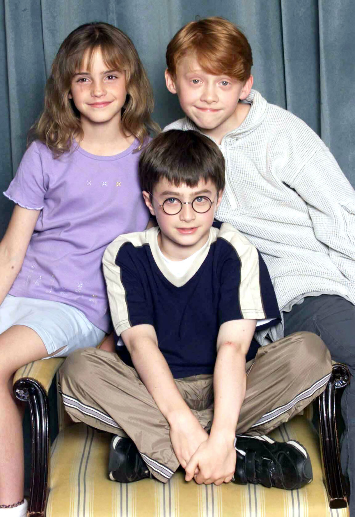 Actors Emma Watson, Rupert Grint and Daniel Radcliffe attend a photocall to present the new cast of the Harry Potter Films