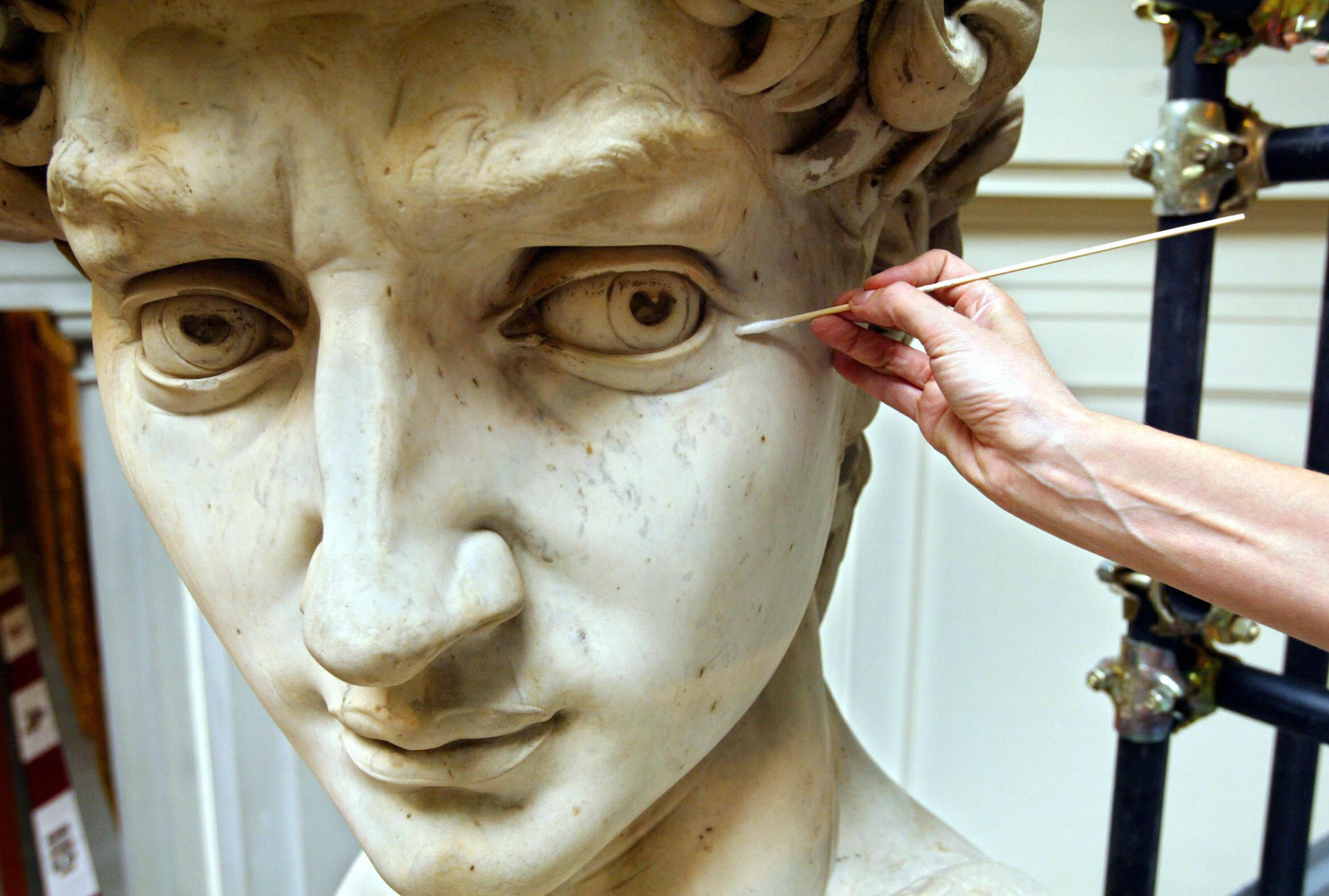 Someone cleaning Michelangelo's David