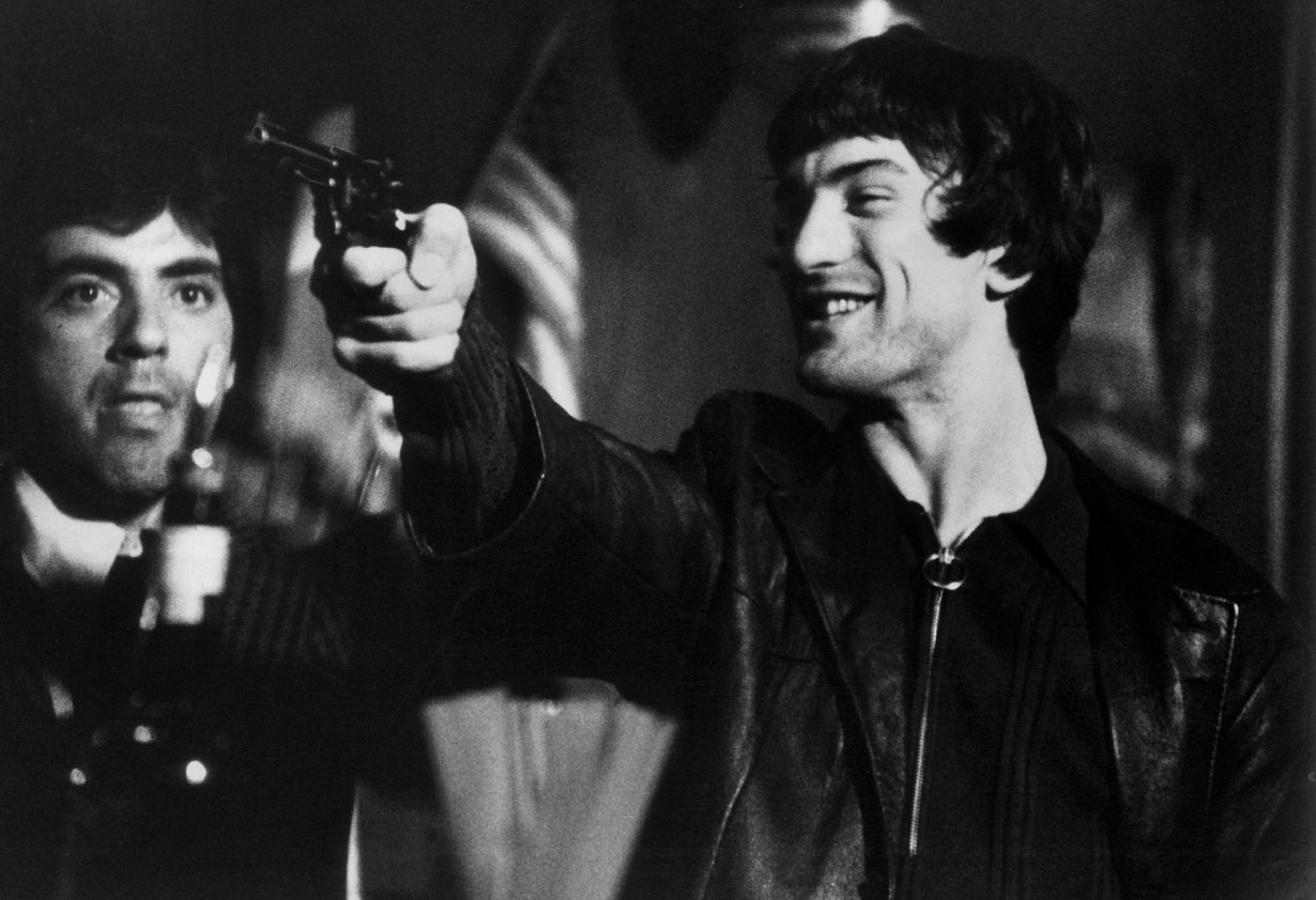 Robert De Niro points a gun in a still from 'Mean Streets.'
