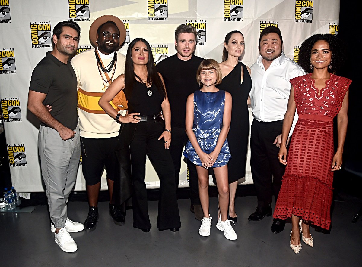 (L-R) Kumail Nanjiani, Brian Tyree Henry, Salma Hayek, Richard Madden, Lia McHugh, Angelina Jolie, Don Lee, and Lauren Ridloff of Marvel Studios' 'Eternals'