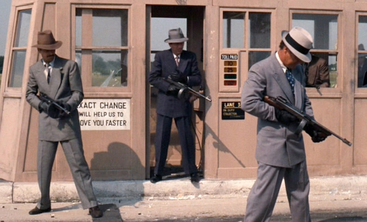 Hitmen holding automatic weapons in 'The Godfather'