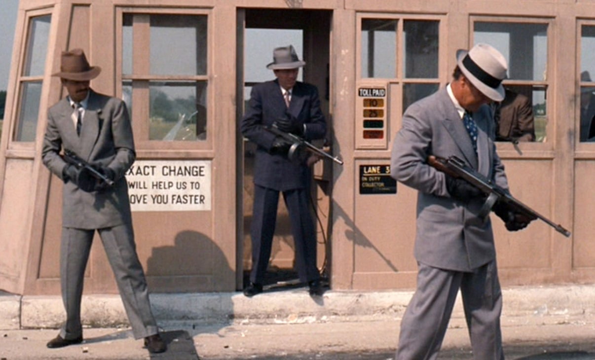 Hitmen holding automatic weapons in 'The Godfather' 