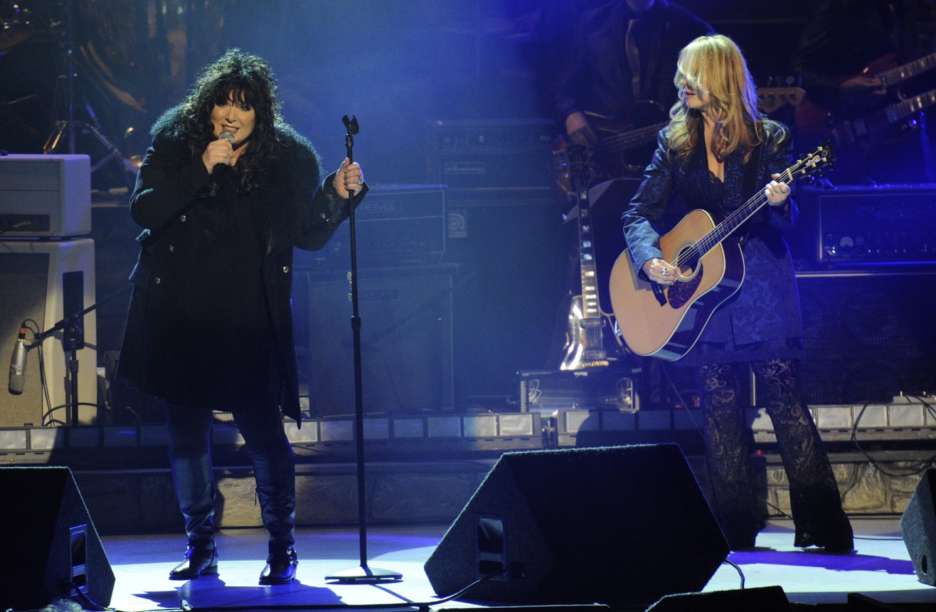 Ann Wilson and Nancy Wilson of Heart on stage in 2012