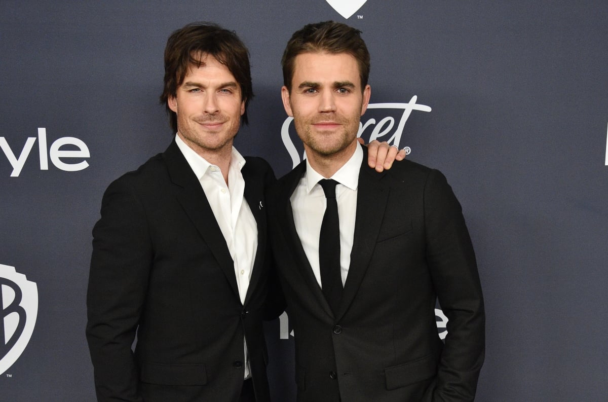 Ian Somerhalder and Paul Wesley attend the 21st Annual Warner Bros. and InStyle Golden Globes afterparty on January 5, 2020. They pose in black suits in front of a grey backdrop. Wesley and Somerhalder are lifelong friends after having starred in 'The Vampire Diaires' together for eight seasons.
