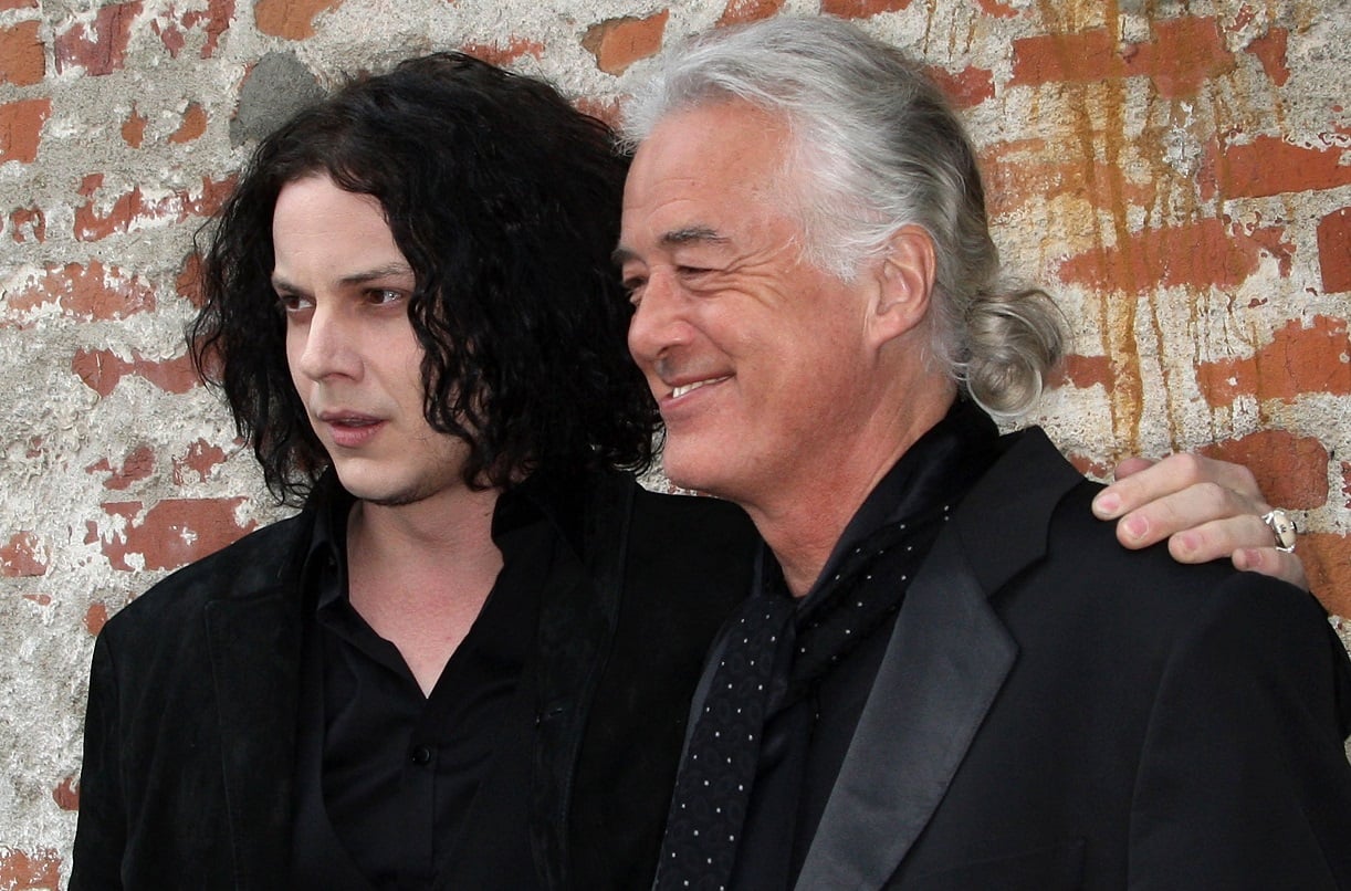 Jack White and Jimmy Page pose for a photo at a 2009 film premiere.