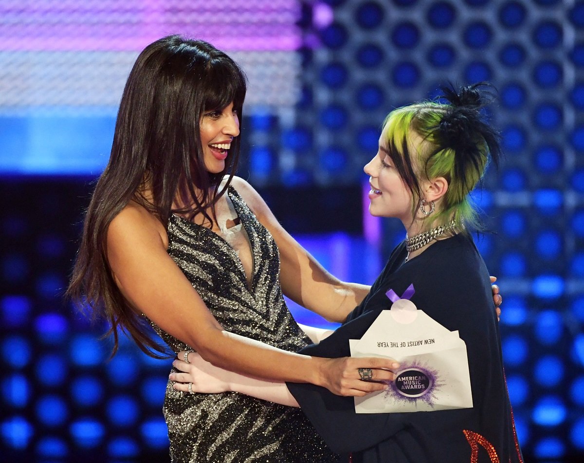 Billie Eilish (R) accepts the New Artist of the Year award from Jameela Jamil onstage during the 2019 American Music Awards on November 24, 2019, in Los Angeles, California.
