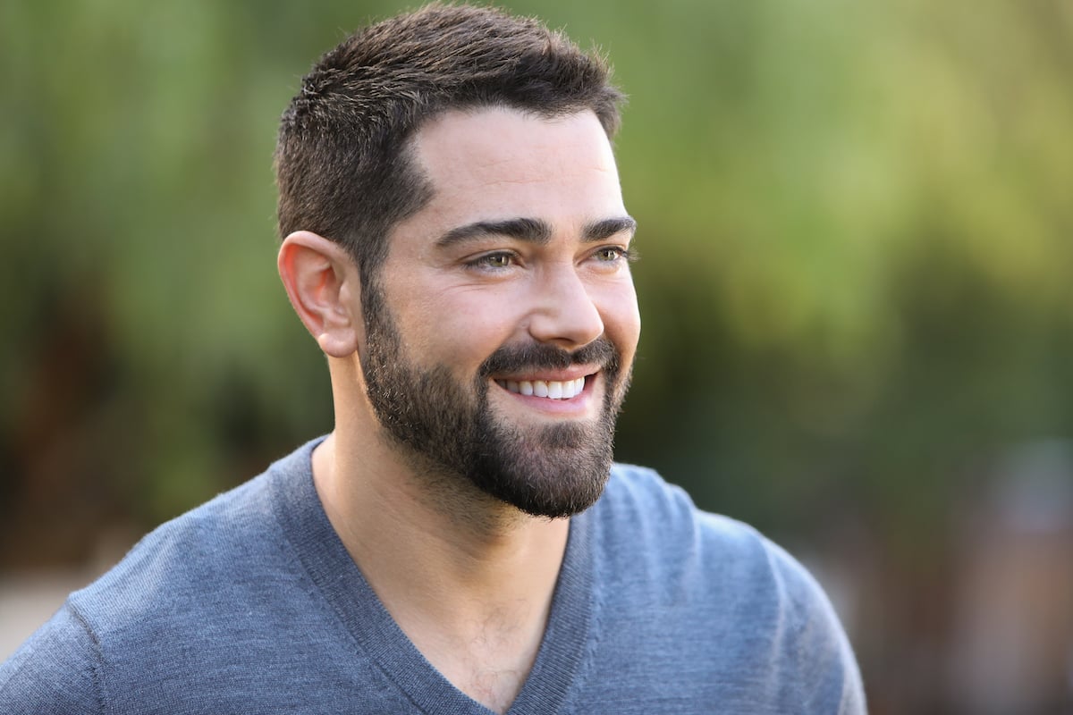 Jesse Metcalfe wearing a blue v-neck shirt