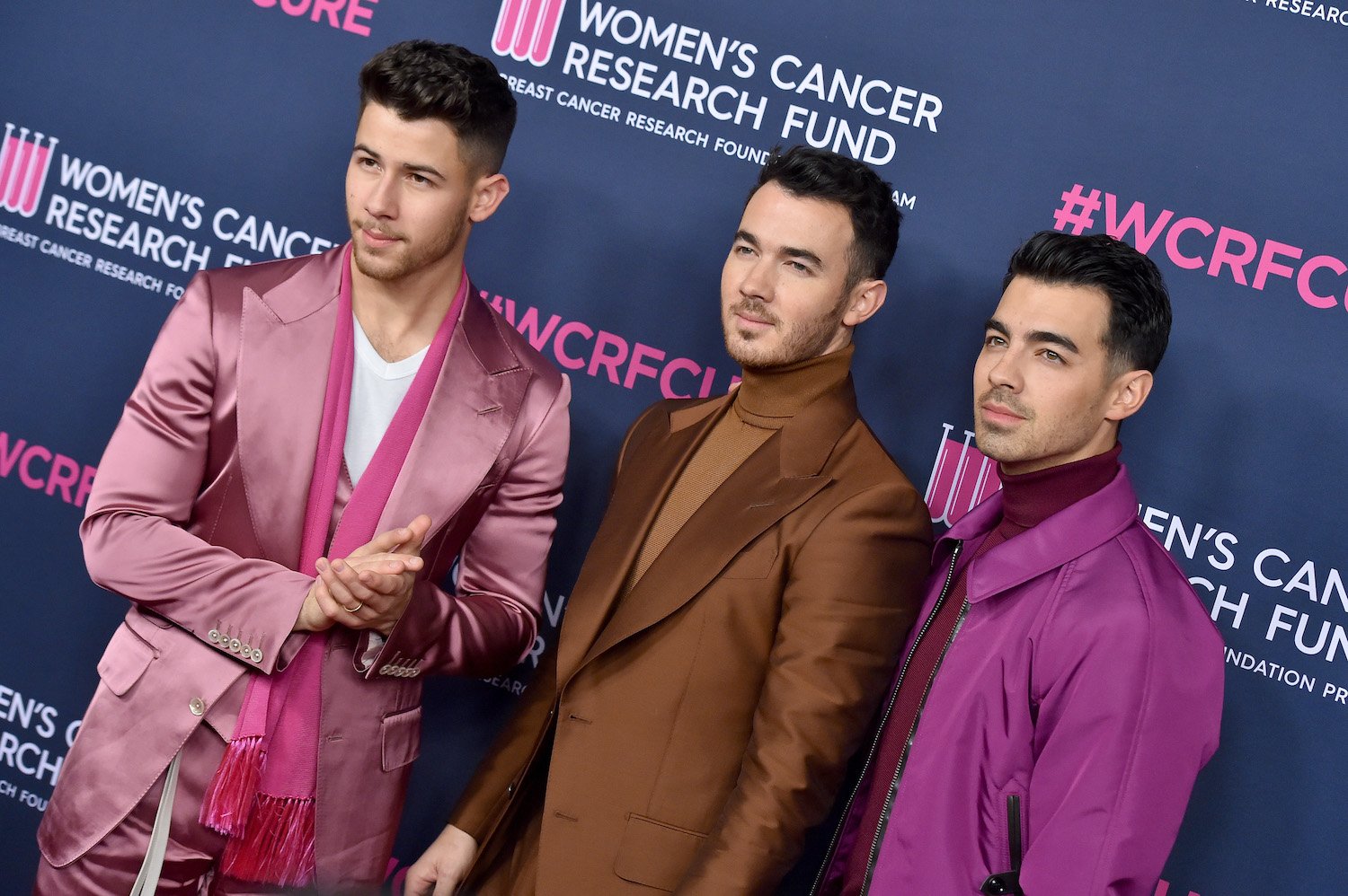 Jonas Brothers: Nick Jonas, Kevin Jonas, and Joe Jonas of Jonas Brothers pose on the red carpet at The Women's Cancer Research Fund's An Unforgettable Evening 2020