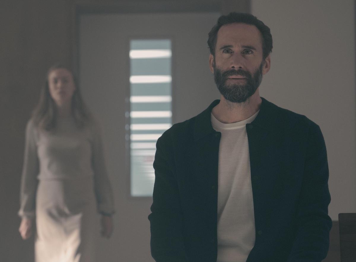 Joseph Fiennes as Fred Waterford and Yvonne Strahovski as Serena Joy Waterford in a small chapel in 'The Handmaid's Tale' Season 4