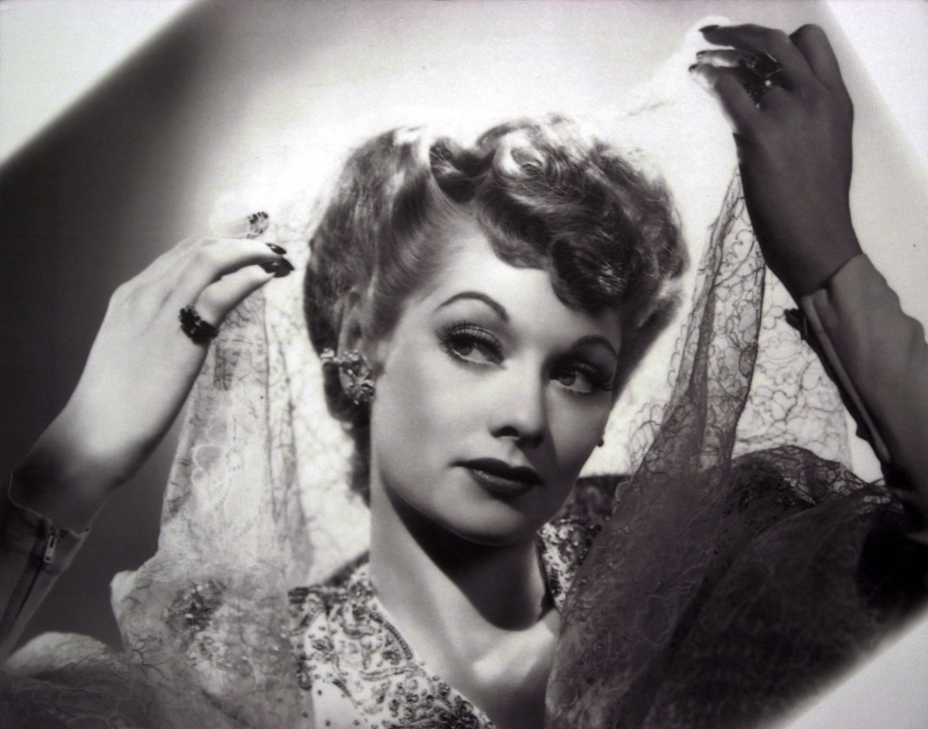 Lucille Ball holding a cloth