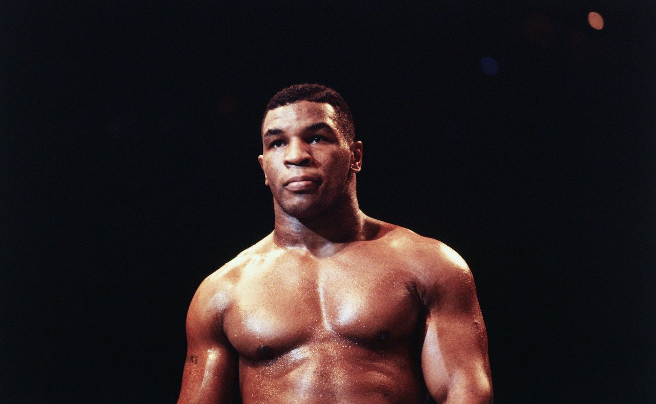 Mike Tyson, a heavyweight contender, warms up before a fight