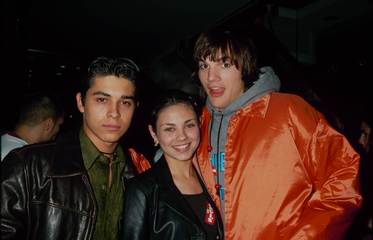 circa 2000: From right to left, Ashton Kutcher, Mila Kunis, Wilmer Valderrama