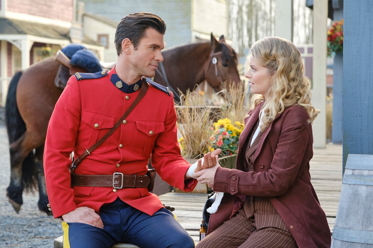 Nathan and Faith looking at each other while she holds his hand