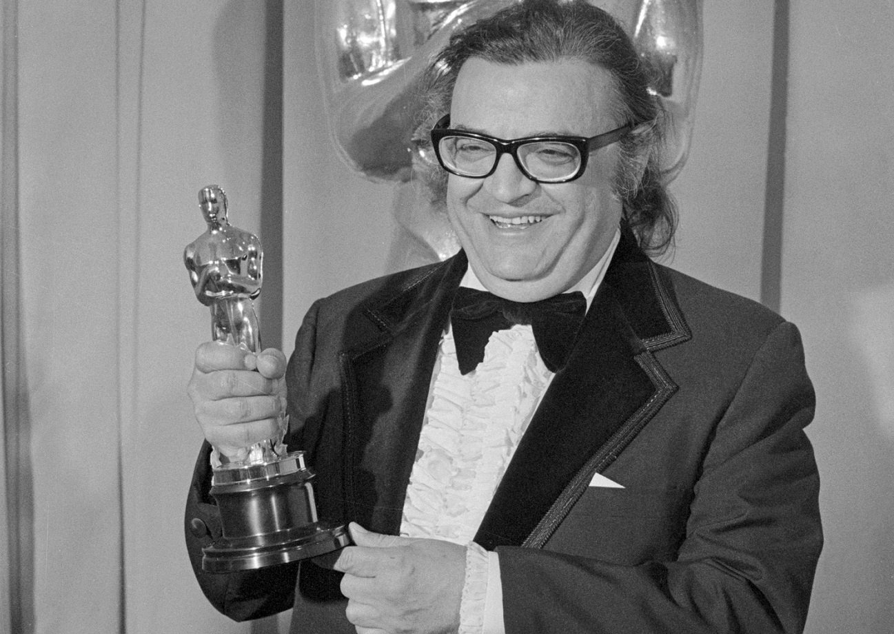 Mario Puzo smiles and holds his Oscar at the 47th Academy Awards.