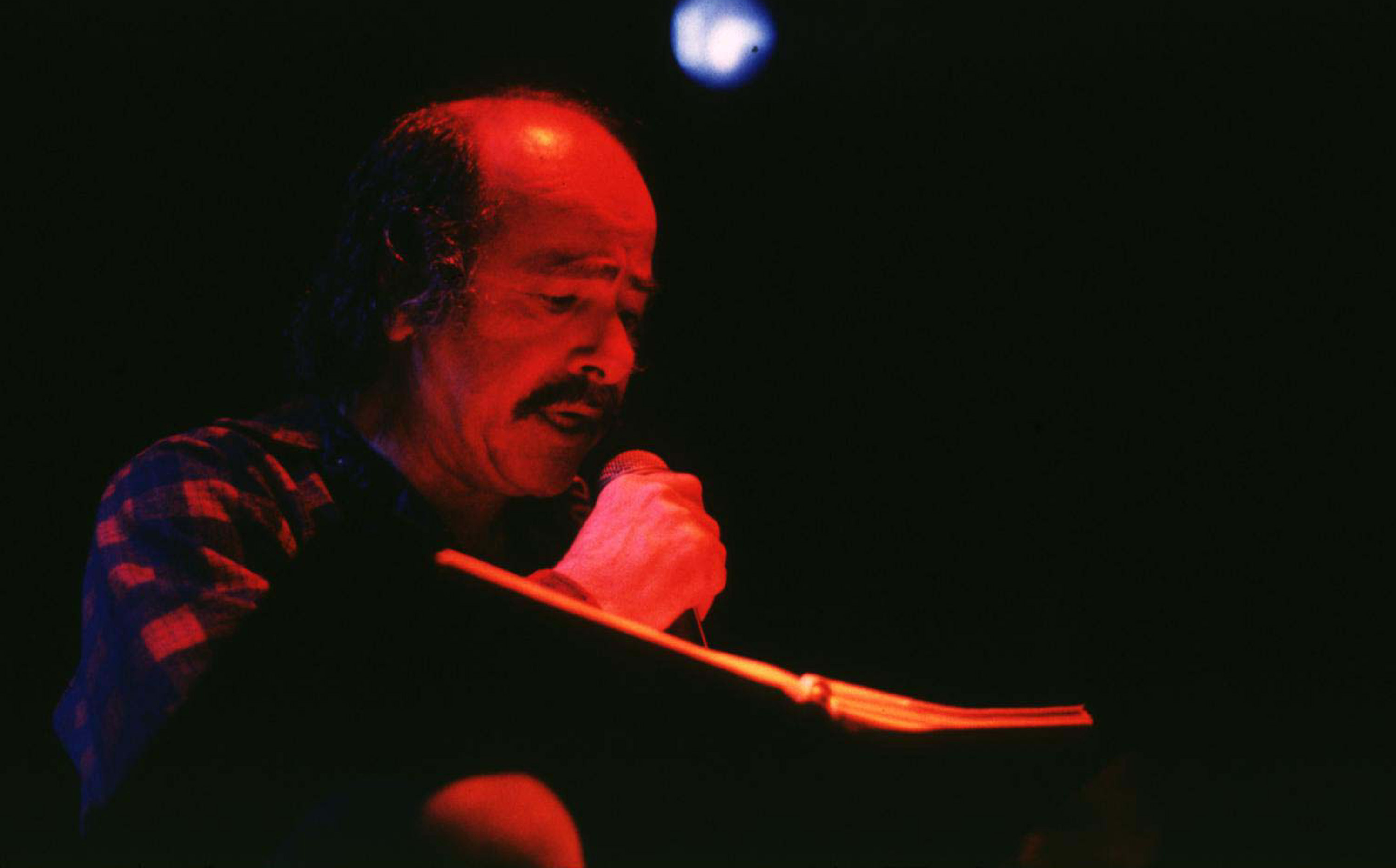 Robert Hunter of the Grateful Dead with microphone
