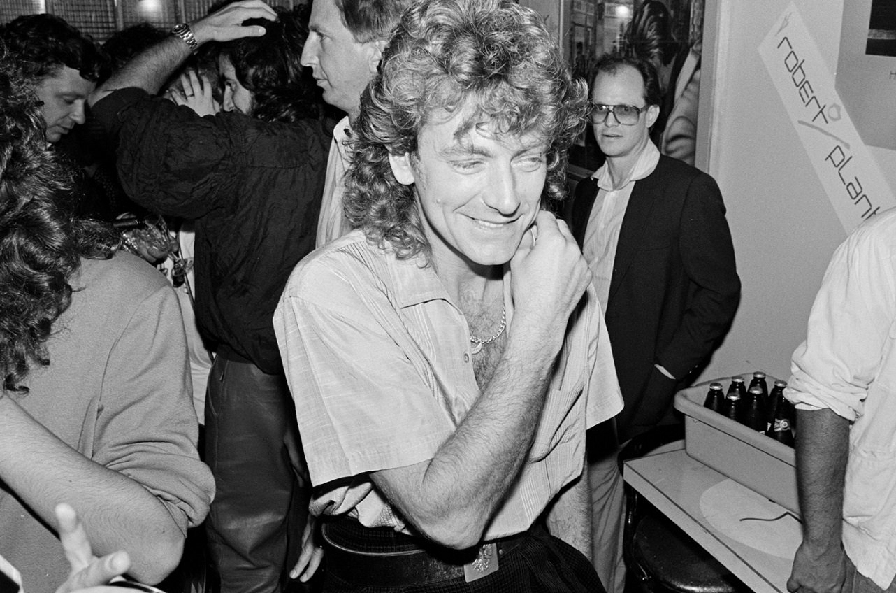 Robert Plant grins at a release party in 1983.