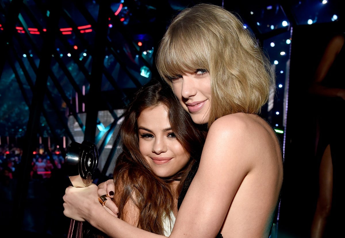 Selena Gomez (L) and Taylor Swift backstage at the iHeartRadio Music Awards on April 3, 2016, in Inglewood, California.  