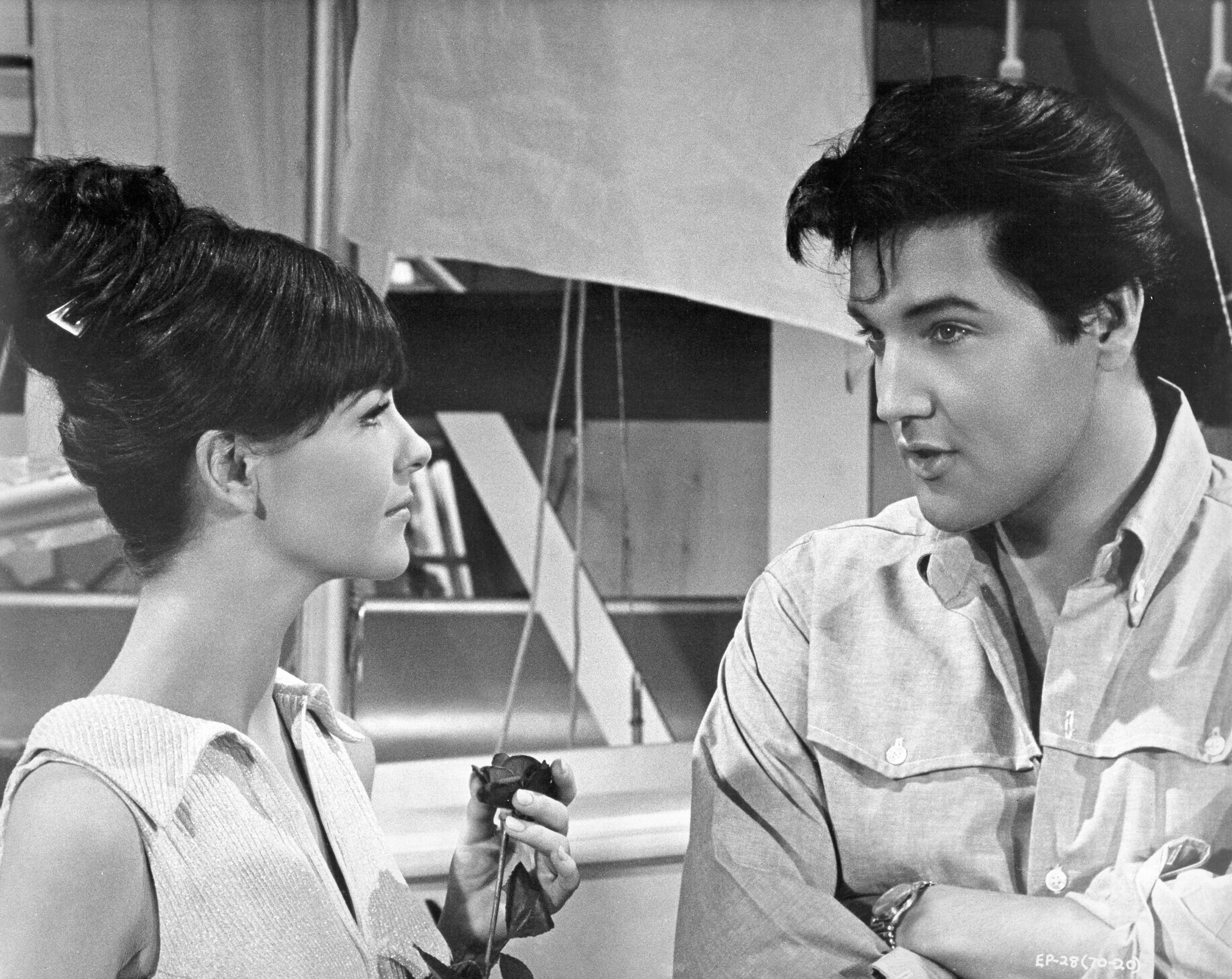 Shelley Fabares and Elvis Presley near a sale