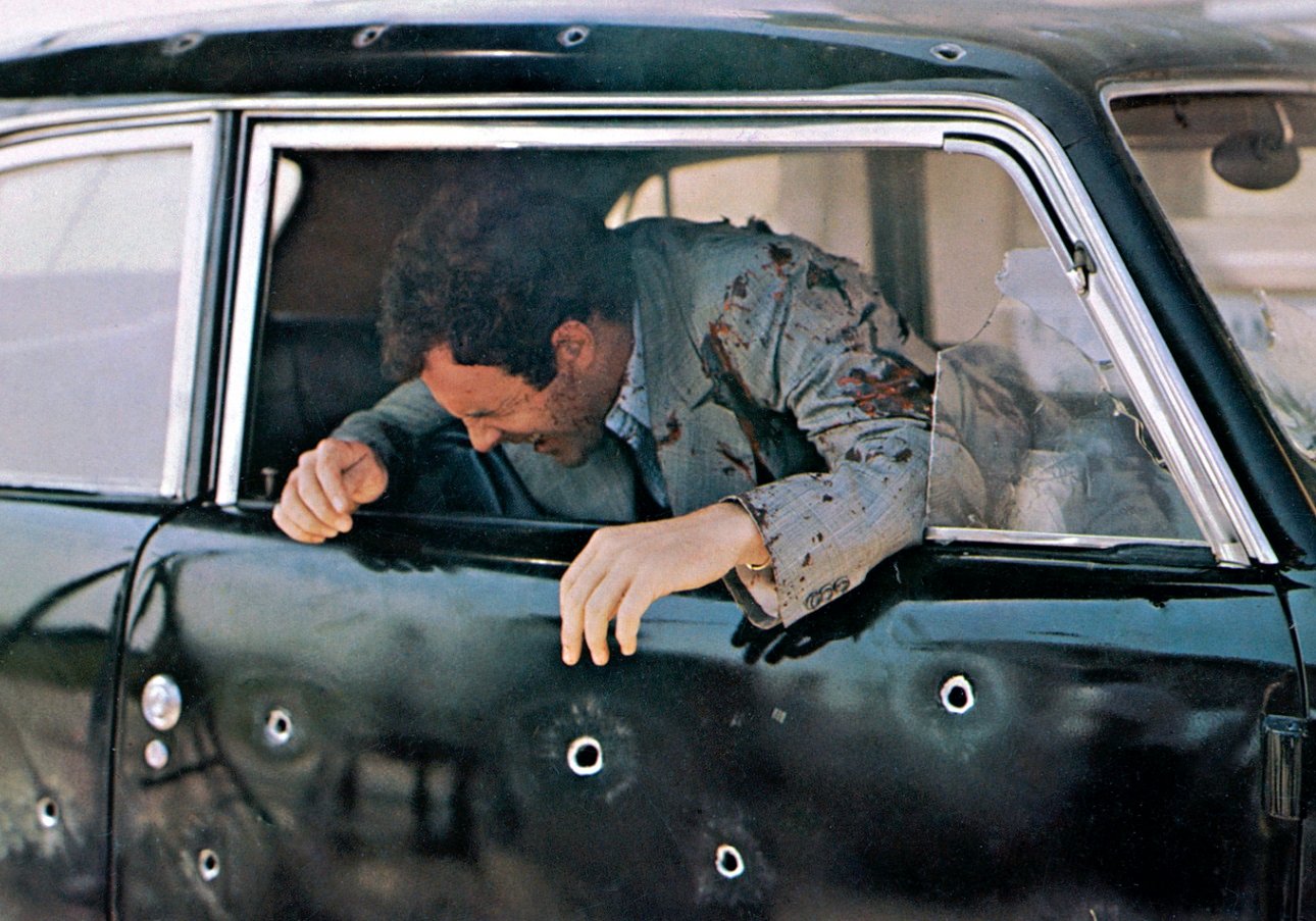 Sonny Corleone being shot dead in a car in 'The Godfather'