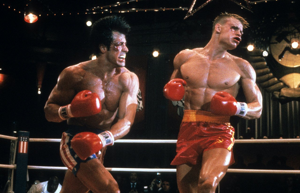 Sylvester Stallone punches Dolph Lundgren in a scene from the film 'Rocky IV', 1985.