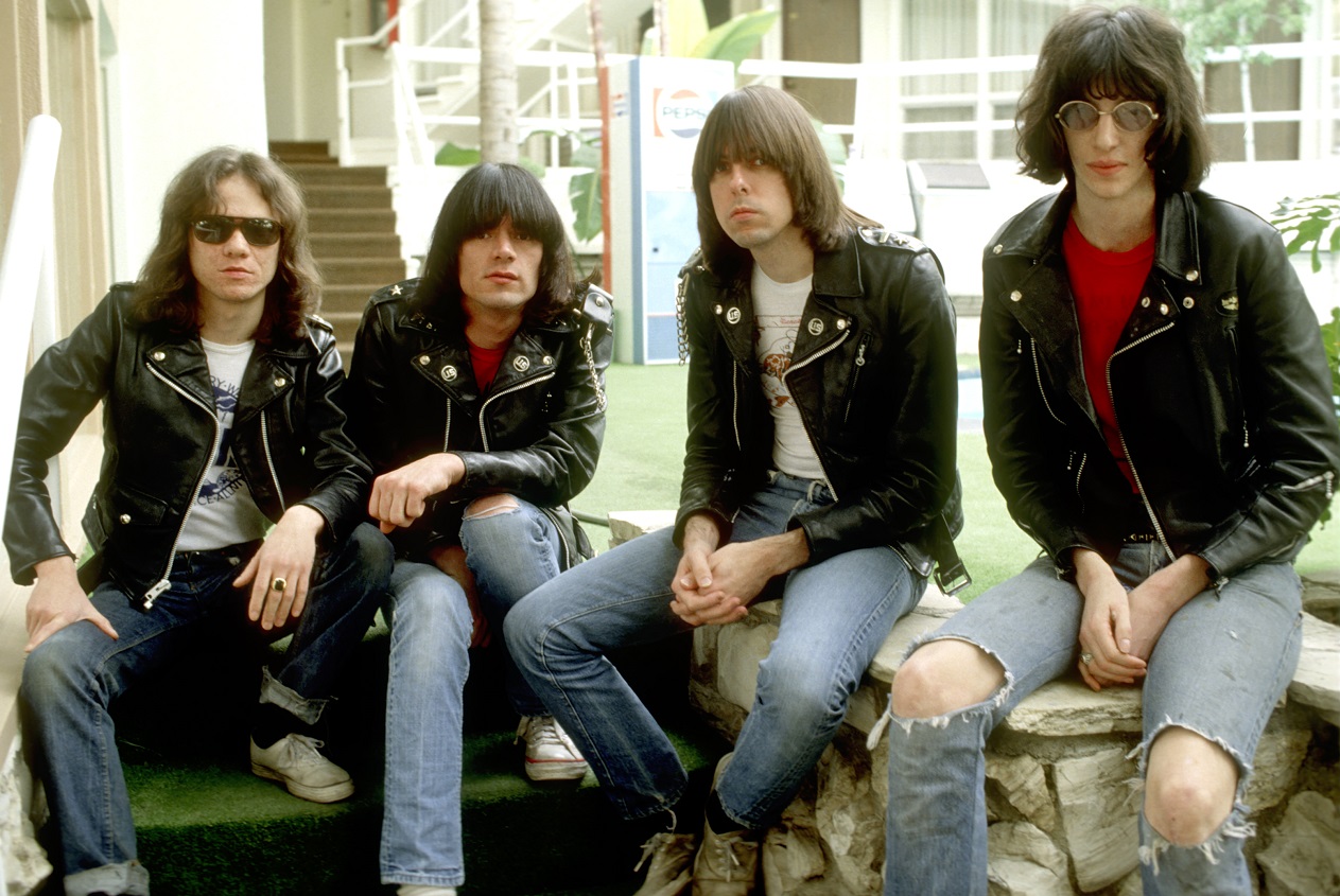 Band photo of the Ramones, seated outdoors