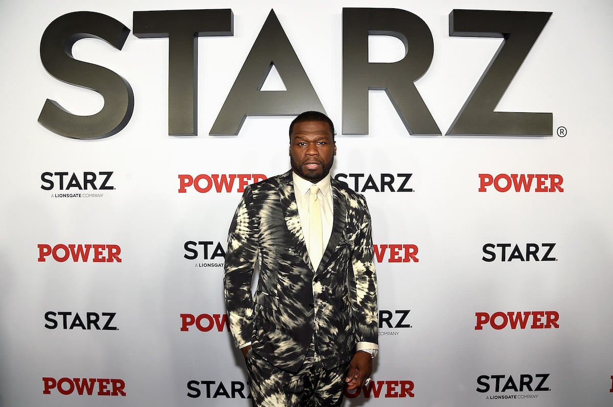 Curtis "50 Cent" Jackson in a black and cream suit