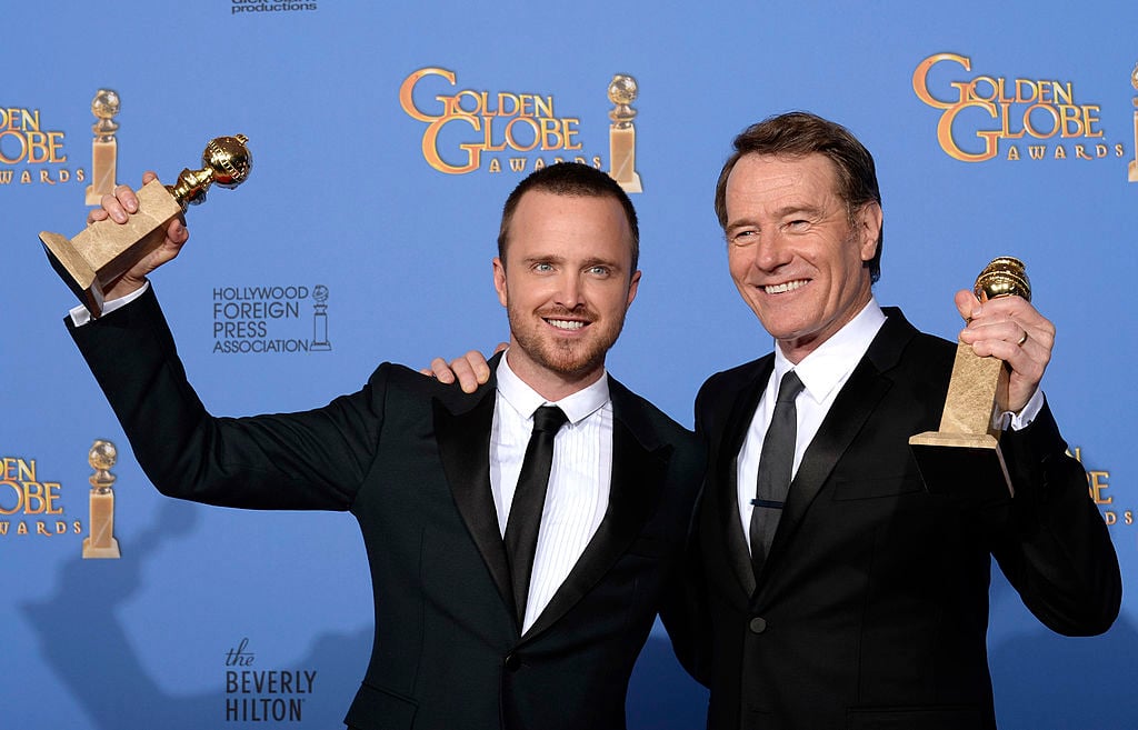 Aaron Paul poses with the award for Best Drama Series and actor Bryan Cranston poses with his award for Best Male Performance in a Television Series  Drama for 'Breaking Bad' in the press room holding their statues