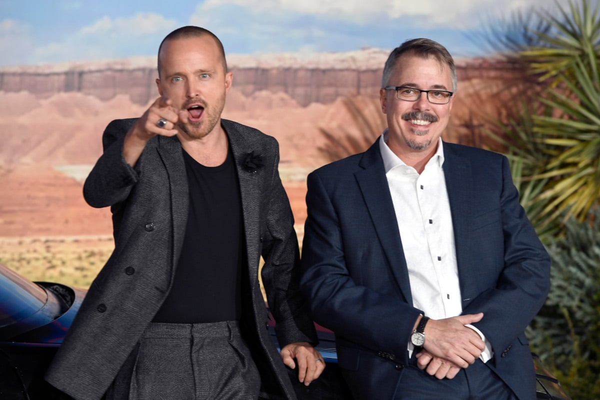 Aaron Paul pointing at the camera and Vince Gilligan smiling during the premiere of 'El Camino'