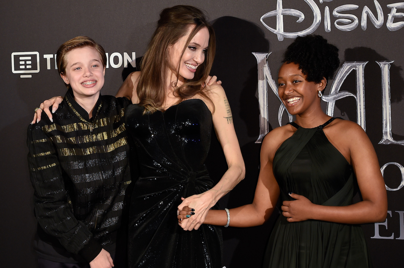 Angelina Jolie smiling with daughters Shiloh and Zahara