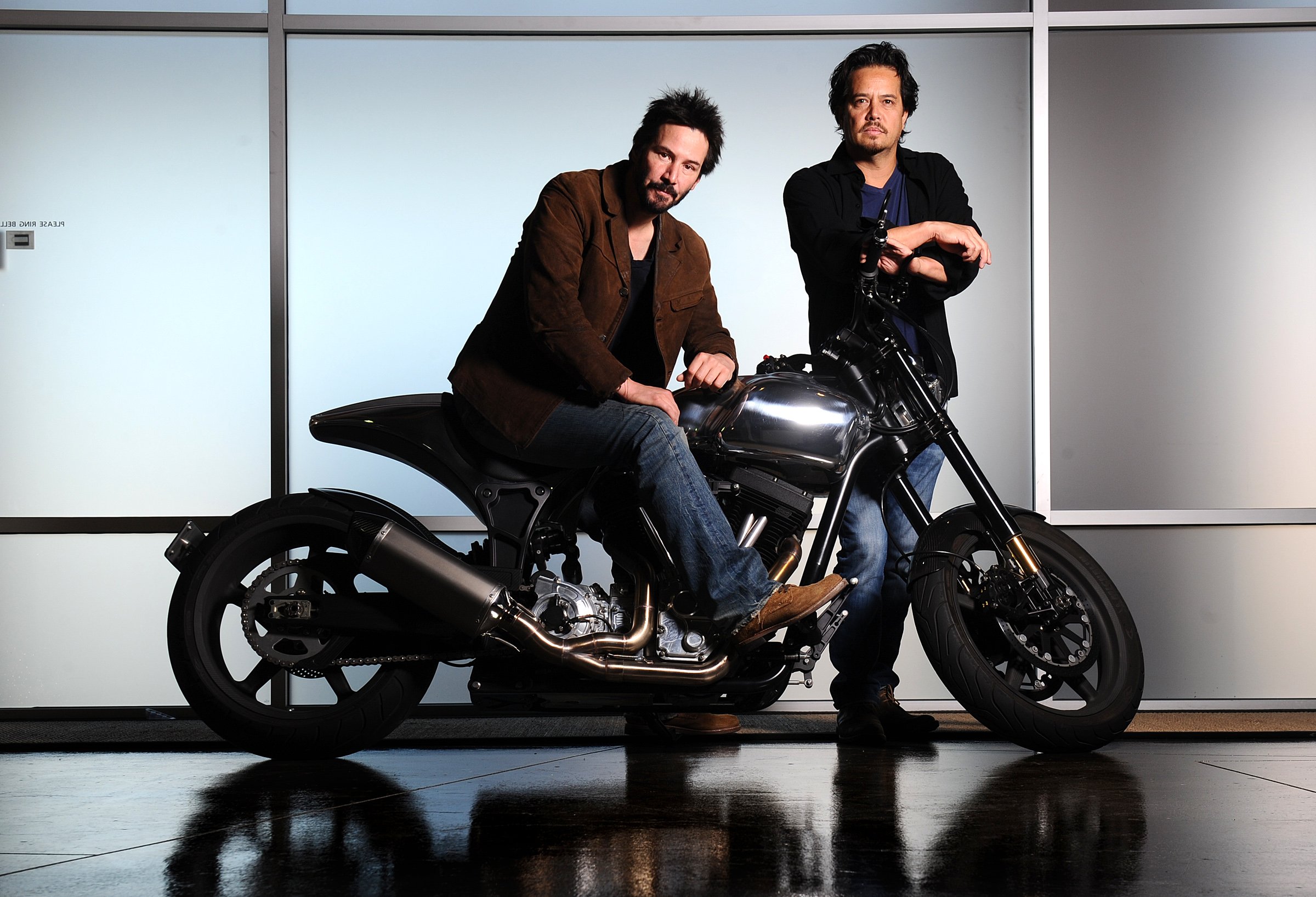 Arch Motorcycle Company founders Keanu Reeves and Gard Hollinger pose with a bike