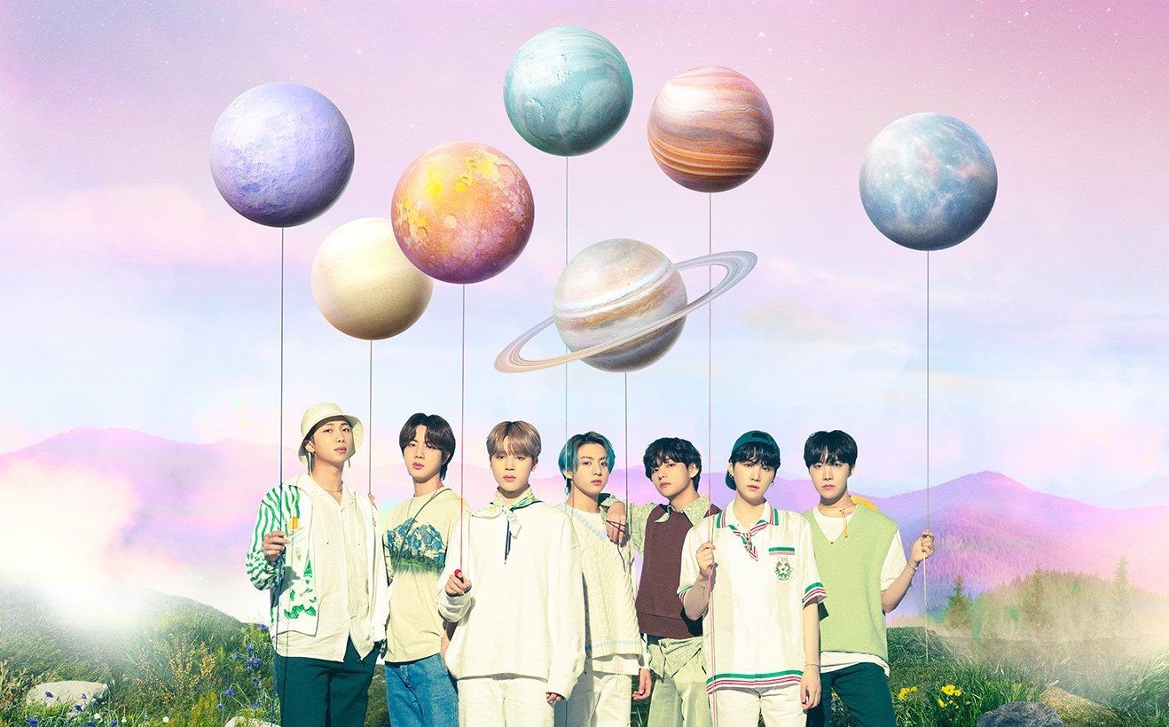 RM, Jin, Jimin, Jungkook, V, Suga, and J-Hope of BTS hold balloons shaped like planets