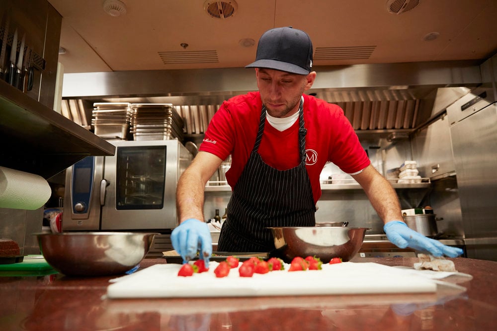 Below Deck Mediterranean Season 6 chef Mathew Shea prepares strawberries.