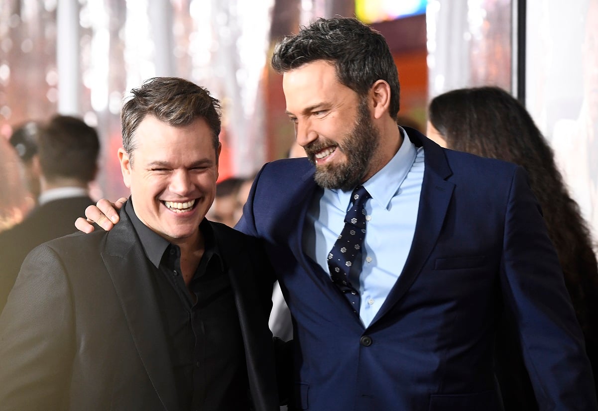 Ben Affleck smiling with his arm around pal Matt Damon at the premiere of Warner Bros. Pictures' Live By Night'