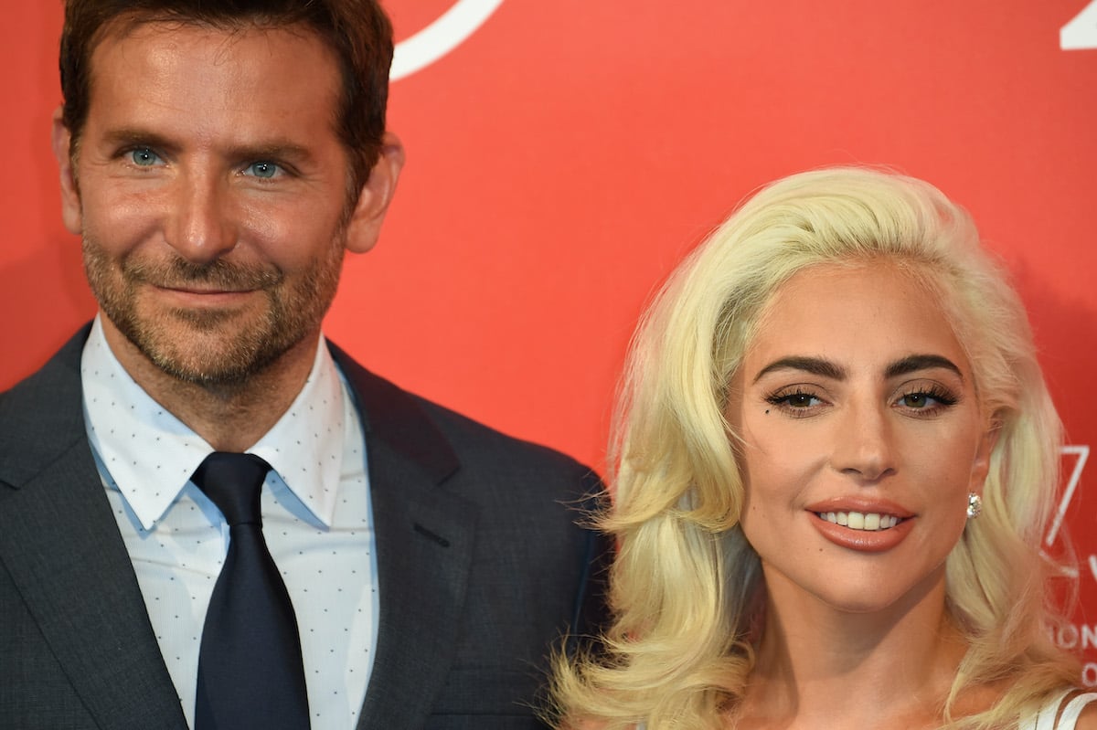 Bradley Cooper and Lady Gaga pose at a red carpet event