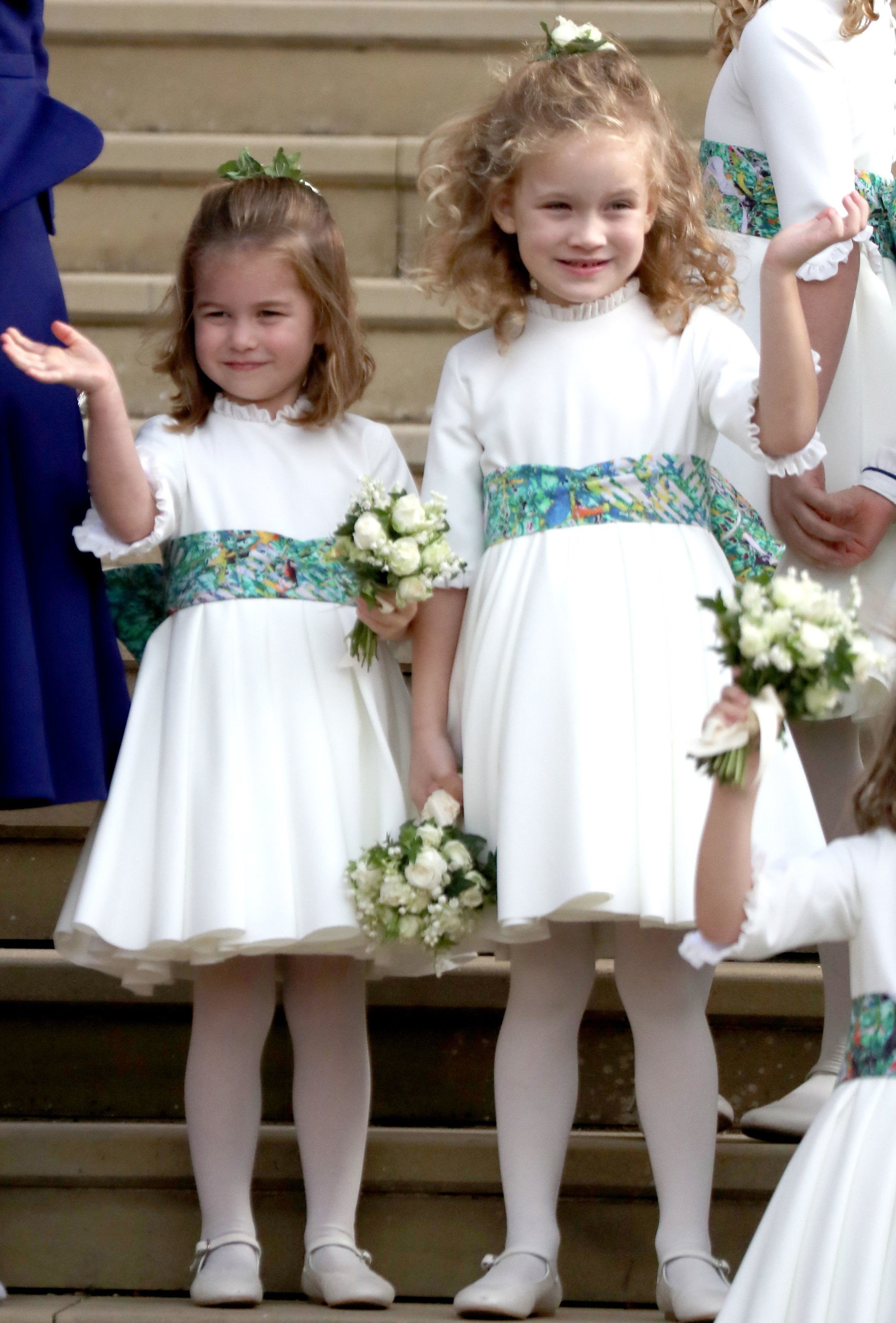 Bridesmaids Princess Charlotte and Maud Windsor waving after the royal wedding of Princess Eugenie and Jack Brooksbank