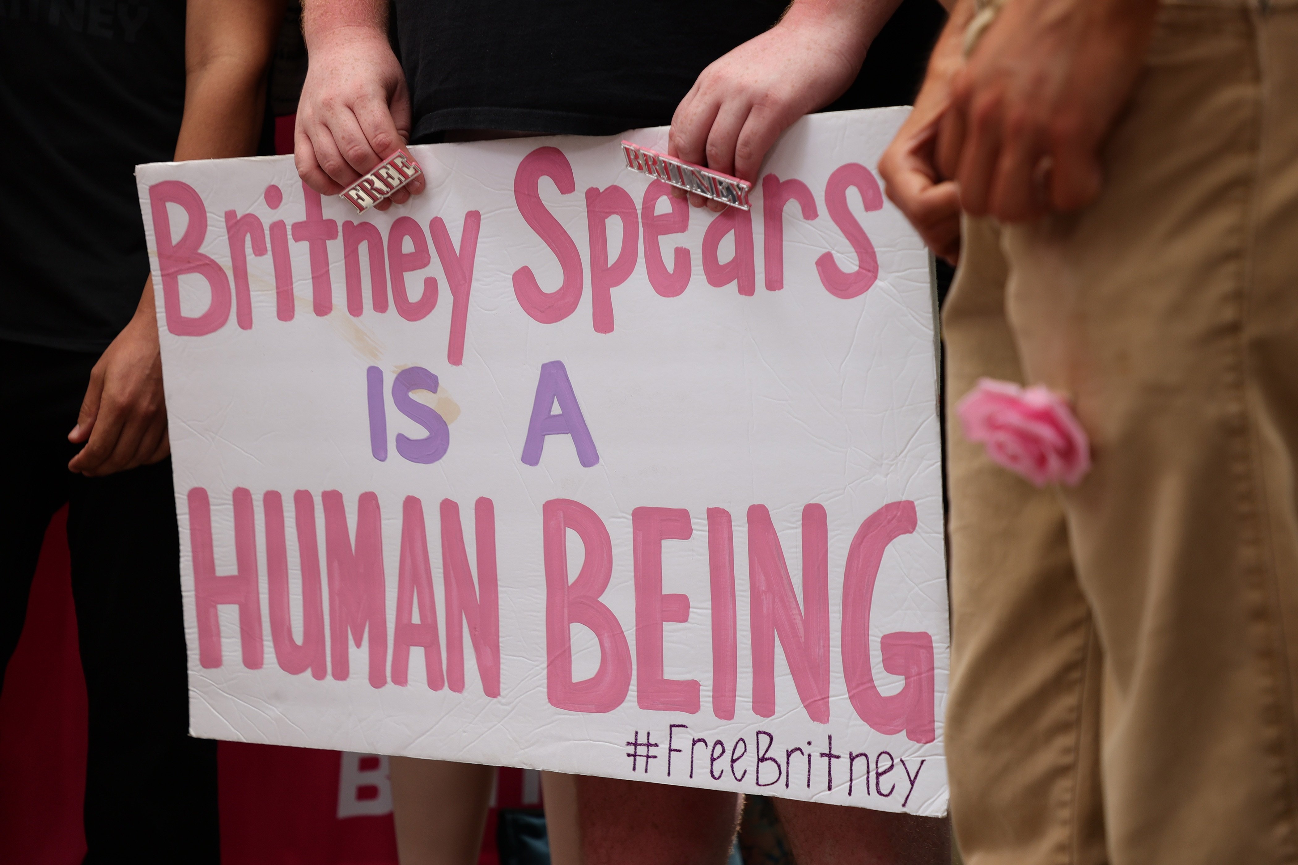 Britney Spears is a Human Being sign that activists held at a protest during Britney Spears conservatorship hearing on June 23