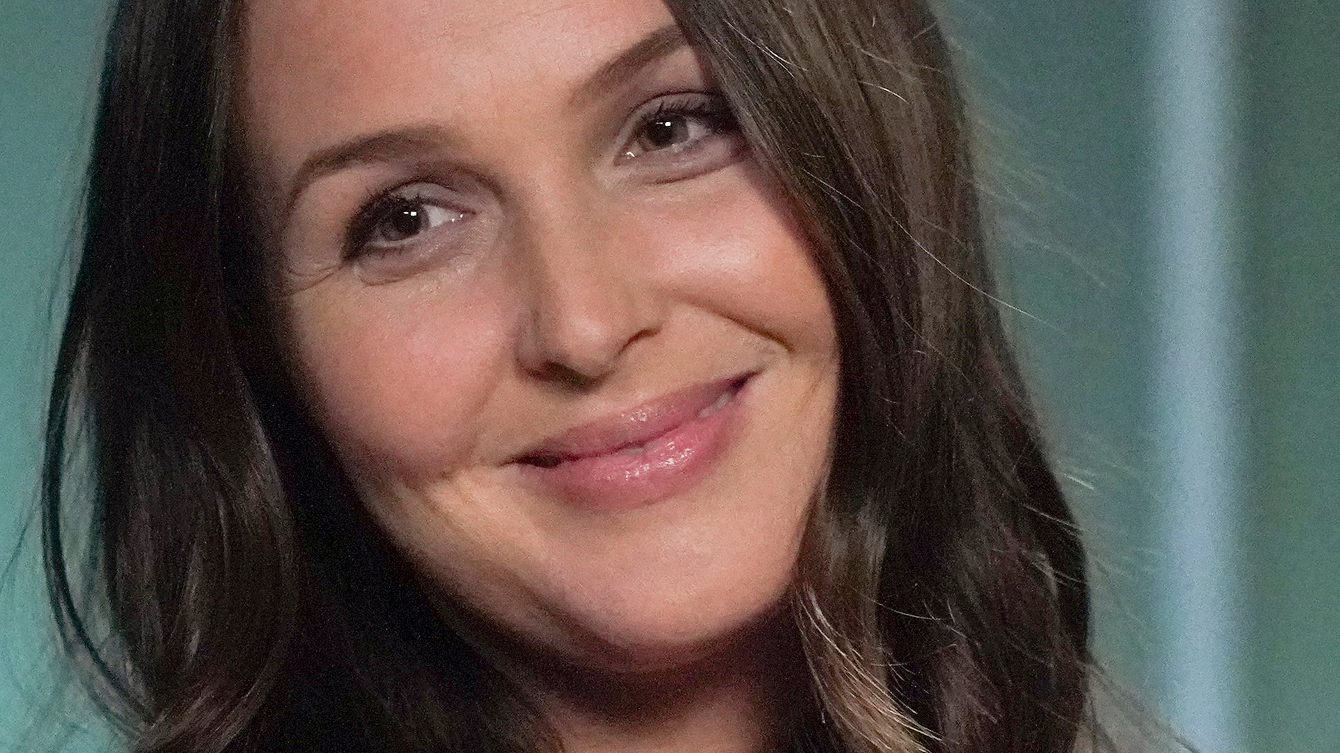 Headshot of Camilla Luddington as Jo Wilson smiling in ‘Grey’s Anatomy’ Season 17 Episode 15, ‘Tradition’