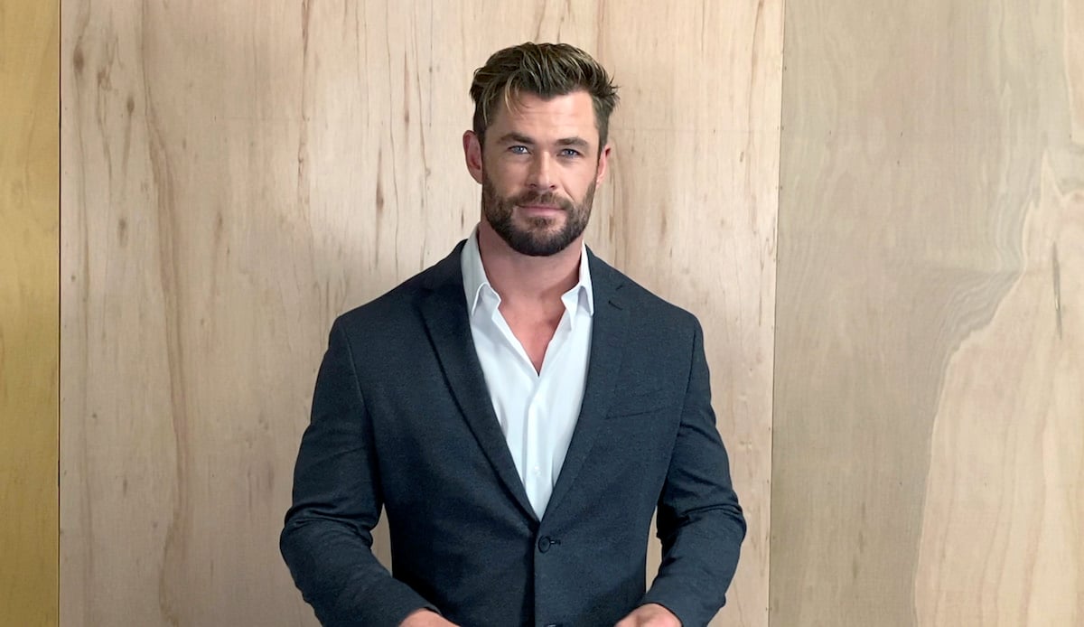 Chris Hemsworth wears a suit jacket and speaks at the 26th Annual Critics Choice Awards
