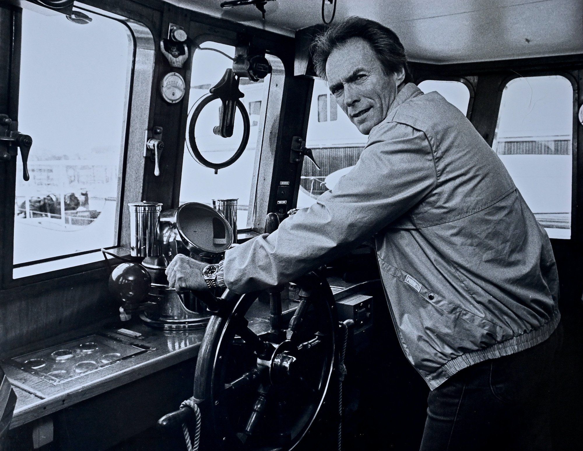 Clint Eastwood standing in his yacht