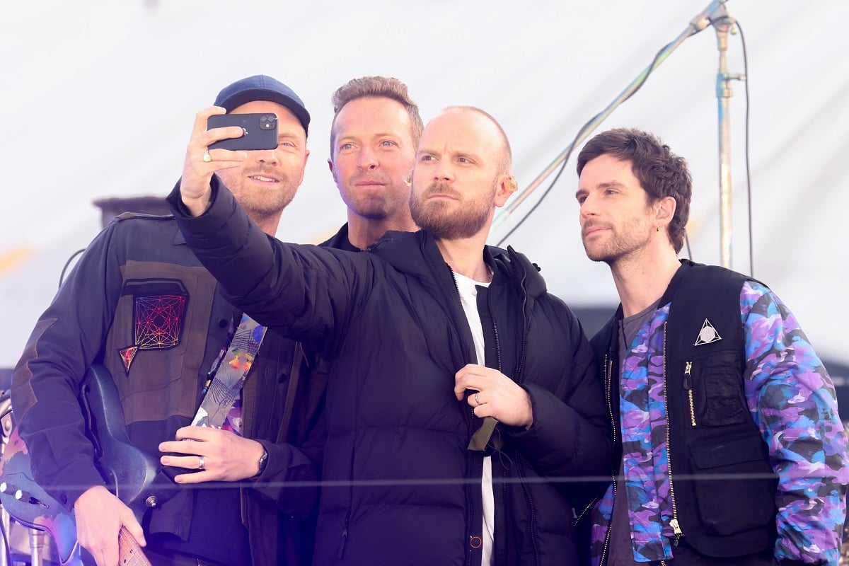 Coldplay members (l to r) Jonny Buckland, Chris Martin, Will Champion and Guy Berryman take a selfie during their performance at The Brit Awards 2021