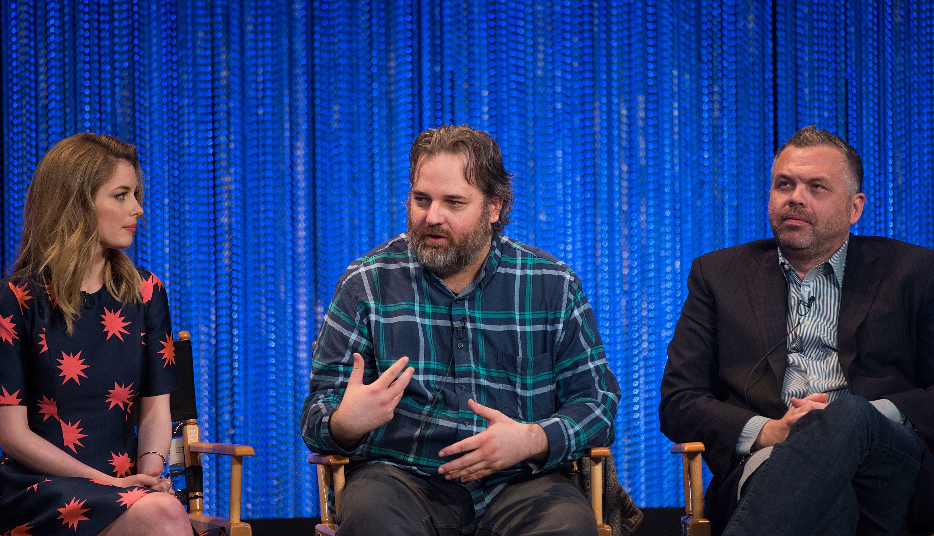 Gillian Jacobs, Dan Harmon and Chris McKenna on stage speaking about 'Community.'